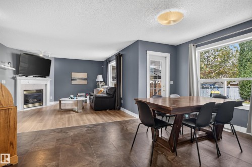 White fireplace with a tile surround - 9826 180 Avenue Nw, Edmonton, AB 