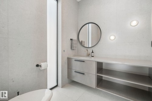 Vanity with integrated sink, open shelving, and drawer storage - 10925 University Avenue Nw, Edmonton, AB 