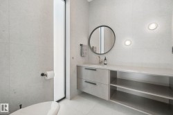 Vanity with integrated sink, open shelving, and drawer storage - 