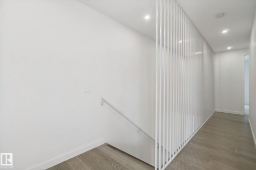 Recessed lighting and wood-finish flooring - 10925 University Avenue Nw, Edmonton, AB 