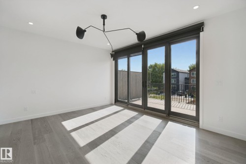 Hardwood-style flooring with a matte finish - 10925 University Avenue Nw, Edmonton, AB 