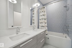 Dual vanity with integrated sinks and chrome fixtures - 