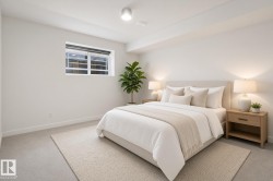 Recessed lighting, light-colored carpet, window with horizontal blinds, neutral wall tones, and ceiling-mounted light fixture - 