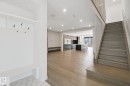 Entryway featuring built-in bench and coat hooks - 10925 University Avenue Nw, Edmonton, AB 
