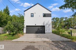 Modern architectural design with a gabled roofline and a stark white exterior - 