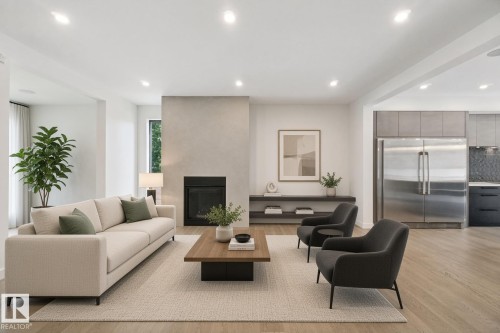 Recessed lighting, wood-finish flooring, and a contemporary fireplace with a plaster-finish surround - 10925 University Avenue Nw, Edmonton, AB 