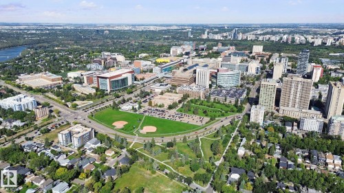 Urban landscape featuring a river, expansive green spaces, and a variety of architectural styles - 10925 University Avenue Nw, Edmonton, AB 