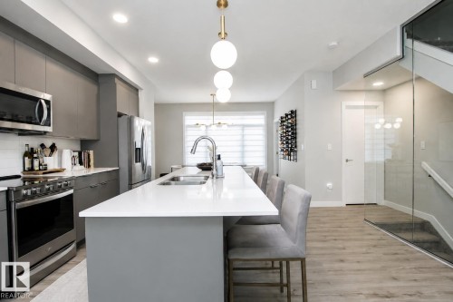 #82 50 Ebony Bv, Sherwood Park, AB - Indoor Photo Showing Kitchen With Stainless Steel Kitchen With Double Sink With Upgraded Kitchen