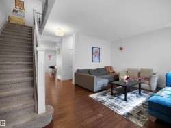 Warm wood-finish flooring throughout the main level - 