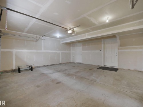 Concrete flooring and unpainted drywall walls - #40 2003 Rabbit Hill Rd Nw, Edmonton, AB 