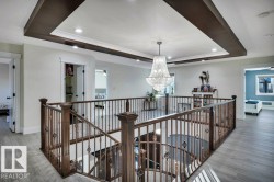 Central landing with a coffered ceiling and recessed lighting - 