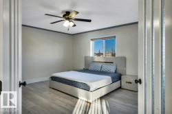 Room featuring light wood-finish flooring, a window with exterior visibility, and a ceiling fan with integrated lighting - 