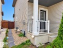 Front entry with concrete steps and white railing - 2829 18A Avenue Nw, Edmonton, AB 