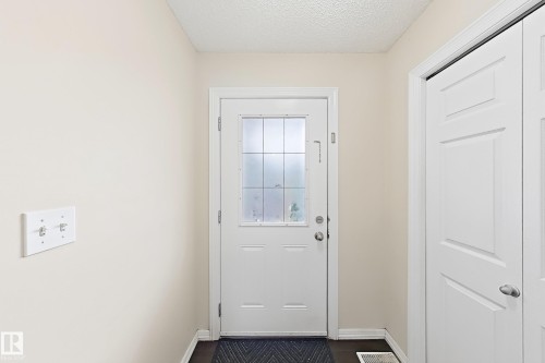 White paneled door with frosted glass insert - 2829 18A Avenue Nw, Edmonton, AB 