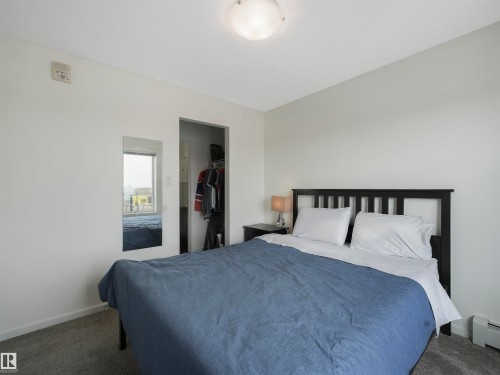 Light-colored walls with textured ceiling - #414 340 Windermere Rd Nw, Edmonton, AB 