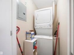 Dedicated laundry area with a stackable washer and dryer unit - 
