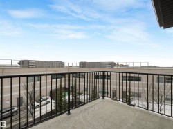 Concrete balcony with black metal railings - 
