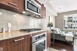Stainless steel microwave, gas cooktop, and built-in oven - 
