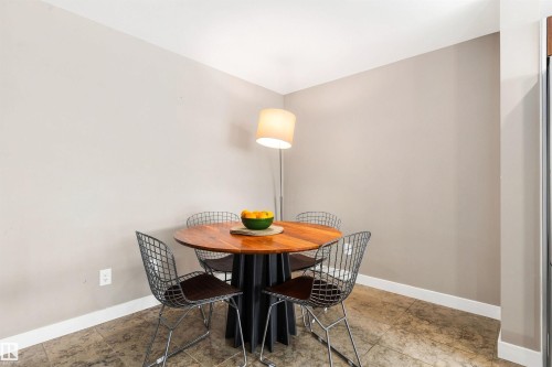 Neutral wall paint, white trim, and a tile floor - #416 2510 109 St Nw, Edmonton, AB 