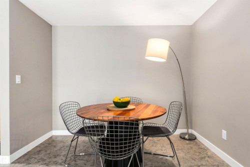 Concrete flooring with light gray walls and white trim - #416 2510 109 St Nw, Edmonton, AB 