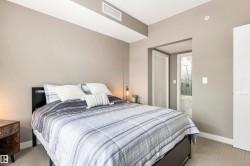 Wall-to-wall carpeting and a recessed ceiling vent - 
