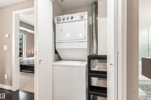 Integrated stacked washer and dryer in dedicated closet - #416 2510 109 St Nw, Edmonton, AB 