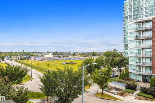 Multi-story building featuring extensive glazing, private balconies, and a brick facade - #416 2510 109 St Nw, Edmonton, AB 