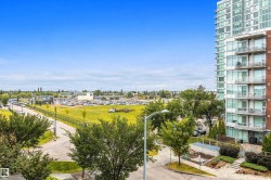 Multi-story building featuring extensive glazing, private balconies, and a brick facade - 