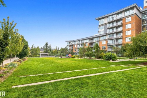 Manicured green space with concrete pathways and mature trees - #416 2510 109 St Nw, Edmonton, AB 