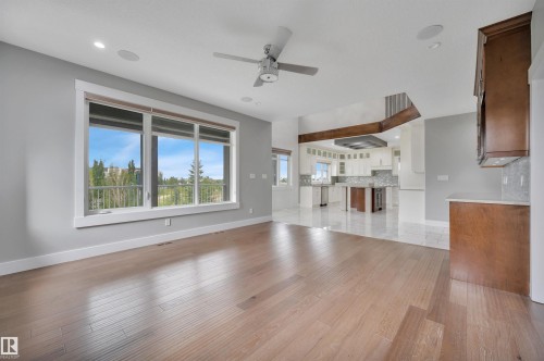 Hardwood flooring, recessed lighting, and a contemporary ceiling fan - 9054 24 Avenue Sw, Edmonton, AB 