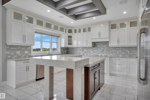 White shaker cabinetry with glass-front accents - 9054 24 Avenue Sw, Edmonton, AB 