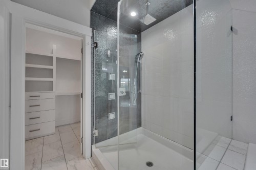 Walk-in shower with tiled walls and glass enclosure - 9054 24 Avenue Sw, Edmonton, AB 