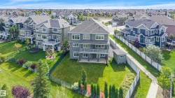 Multi-level property with balconies and an expansive green lawn - 