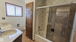 Dual vanity with integrated sinks and a light-colored countertop - 