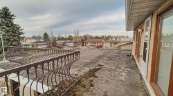 Upper-level balcony with wrought iron railing and direct exterior access - 