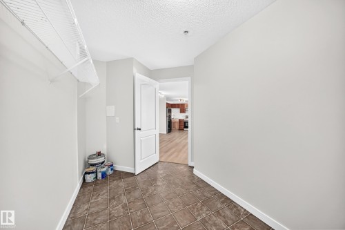 Tile flooring, light-toned walls, and a white wire shelf - #1303 330 Clareview Station Dr Nw, Edmonton, AB 