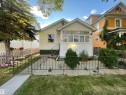 White siding exterior with a dark green foundation - 11230 96 Street Nw, Edmonton, AB 