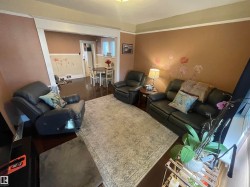 Hardwood-finish flooring, cased opening, and recessed ceiling details - 