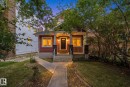 Front exterior with red siding and stone column accents - 10143 123 Street Nw, Edmonton, AB 