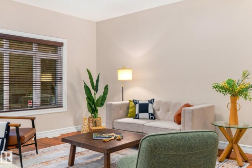 Hardwood-finish flooring, white window trim with blinds, and neutral wall tones - 10143 123 Street Nw, Edmonton, AB 