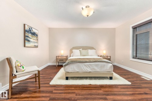 Wood-finish flooring, neutral wall tones, and a window with blinds - 10143 123 Street Nw, Edmonton, AB 