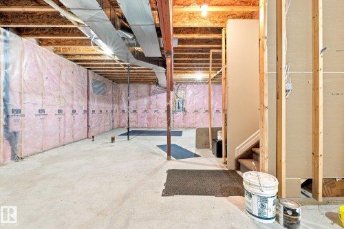 Unfinished basement offering exposed wood framing, concrete flooring, and visible insulation - 10143 123 Street Nw, Edmonton, AB 