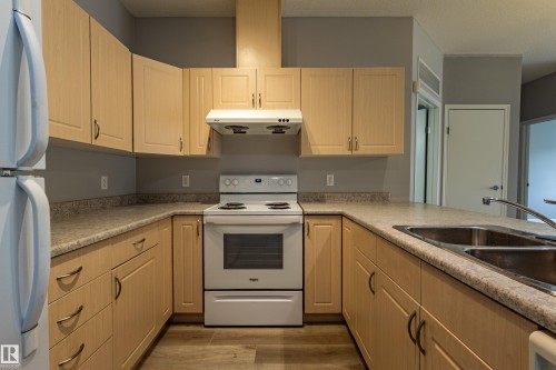 Kitchen - #412 4304 139 Av Nw, Edmonton, AB - Indoor Photo Showing Kitchen With Double Sink