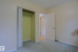 Built-in closet with bi-fold doors and hanging rod - 