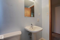 Pedestal sink with chrome-finish faucet and wall-mounted mirror - 