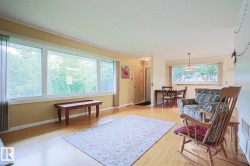 Wood-finish flooring, expansive window array, and recessed entryway - 