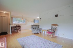 Light wood-finish flooring throughout, complemented by light-toned walls - 