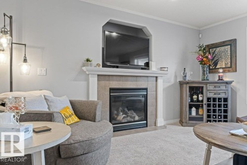 271 Westwood Point(E), Fort Saskatchewan, AB - Indoor Photo Showing Living Room With Fireplace