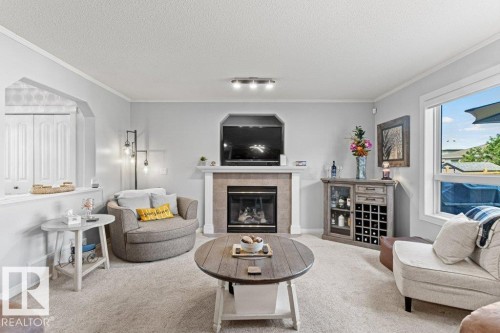271 Westwood Point(E), Fort Saskatchewan, AB - Indoor Photo Showing Living Room With Fireplace