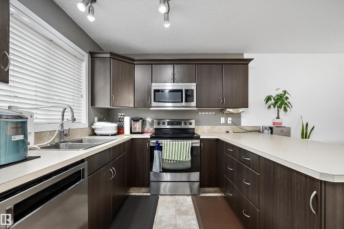 306 Simmonds Way, Leduc, AB - Indoor Photo Showing Kitchen With Double Sink